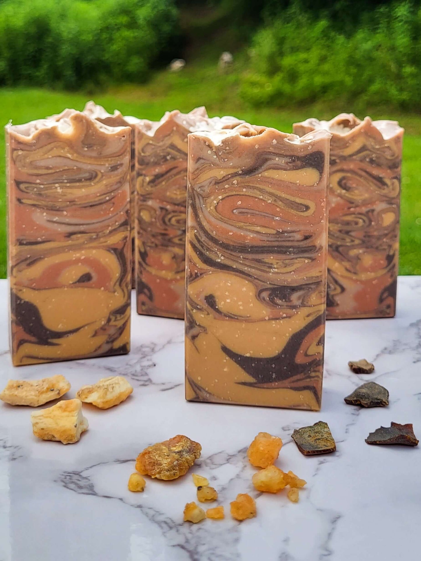 Cold Process Lard Soap. Brown, gold, and copper bars of soap with resin incense