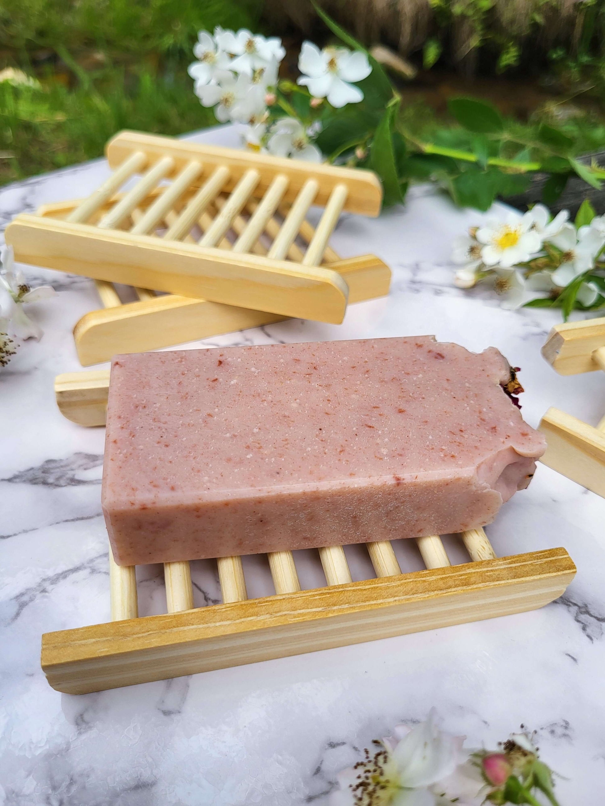 Old fashioned lard rose soap on natural bamboo soap dish