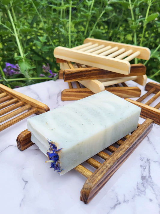 Old fashioned lard soap on natural bamboo soap dish
